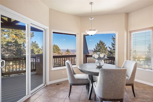 dining room with tile patterned flooring