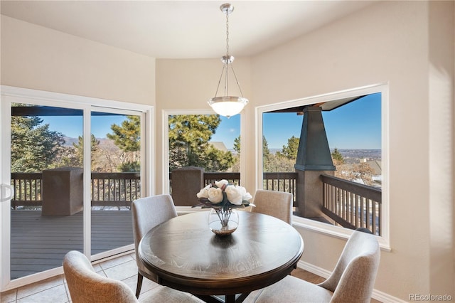 dining area with light tile patterned floors