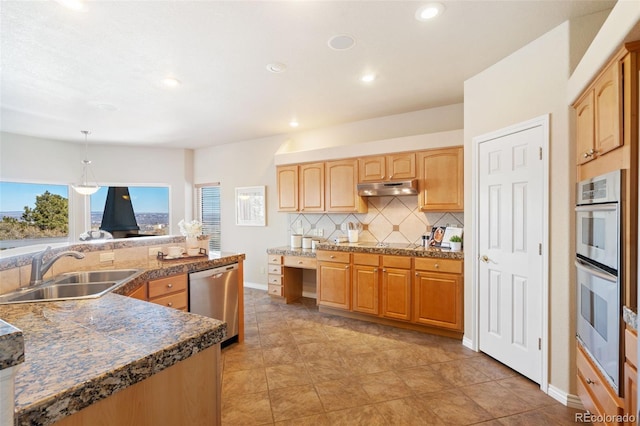 kitchen with pendant lighting, sink, appliances with stainless steel finishes, tasteful backsplash, and light tile patterned flooring