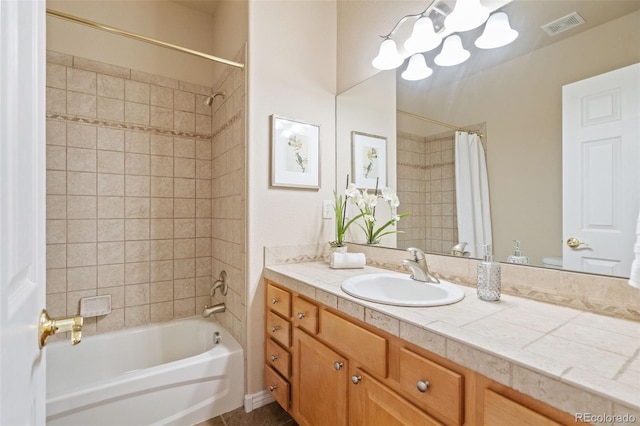 bathroom featuring vanity, shower / tub combo with curtain, and a chandelier