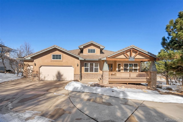 craftsman inspired home featuring a garage and covered porch