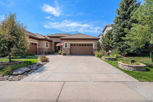 view of front of home with a garage and a front yard