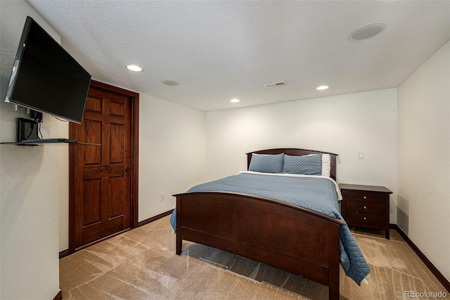 carpeted bedroom with a textured ceiling