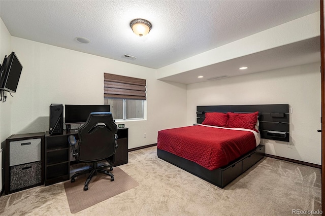 carpeted bedroom featuring a textured ceiling