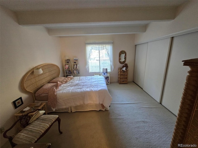 carpeted bedroom featuring a closet and beam ceiling