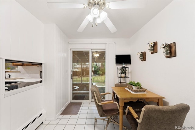 3888 Estes St, Wheat Ridge, CO 80033 - dining area with a baseboard radiator, ceiling fan, and light tile patterned floors