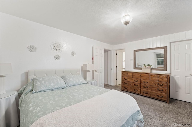 3888 Estes St, Wheat Ridge, CO 80033 - bedroom featuring carpet floors and a textured ceiling