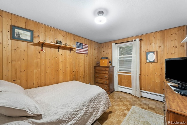 3888 Estes St, Wheat Ridge, CO 80033 - bedroom featuring wooden walls and baseboard heating