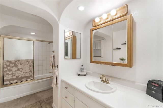 3888 Estes St, Wheat Ridge, CO 80033 - bathroom featuring vanity, bath / shower combo with glass door, tile patterned floors, and recessed lighting
