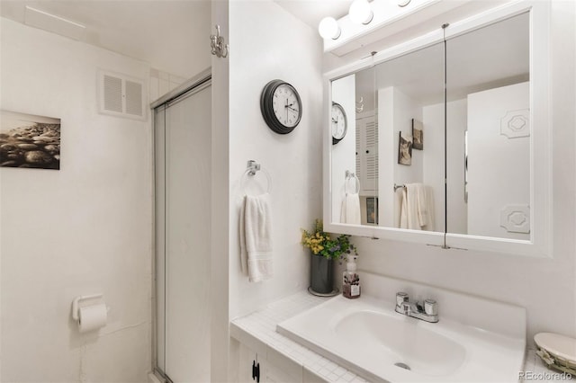 3888 Estes St, Wheat Ridge, CO 80033 - full bath featuring a stall shower and vanity