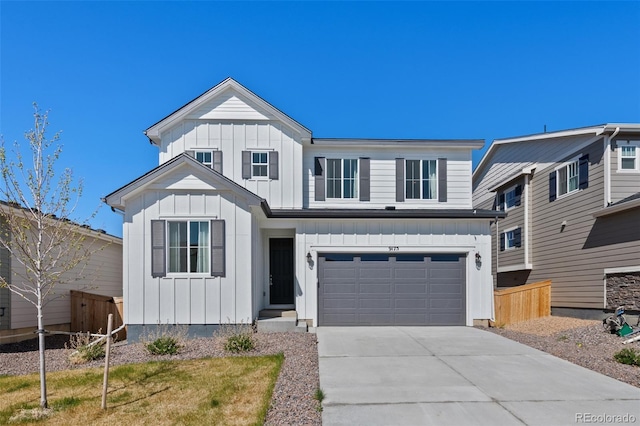 view of front facade featuring board and batten siding, fence, a garage, and concrete driveway