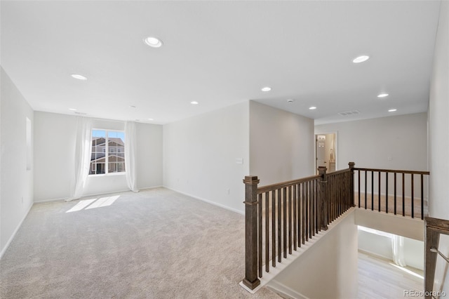 unfurnished room featuring recessed lighting, carpet floors, and baseboards