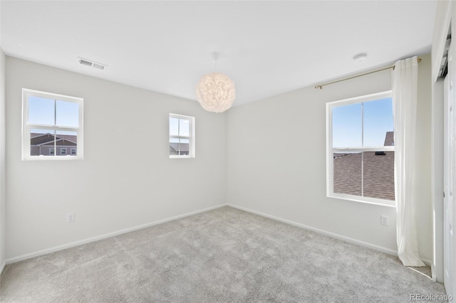 empty room with carpet flooring and baseboards