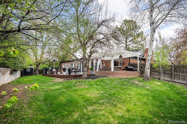 4011 S Ivy Ln, Cherry Hills Village, CO 80111 - fenced backyard featuring a wooden deck and a storage unit