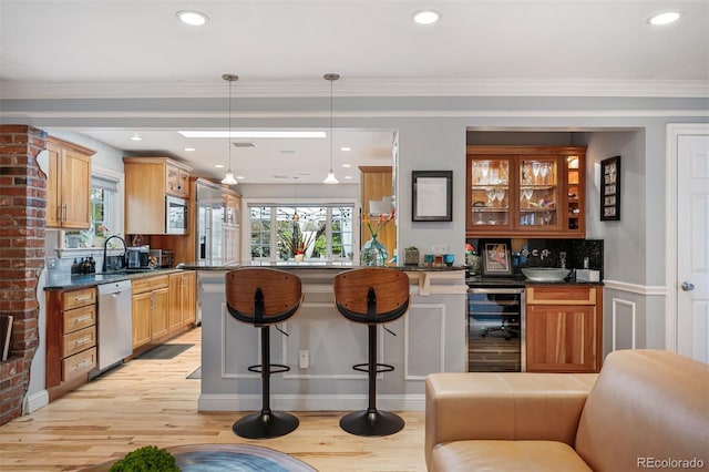 4011 S Ivy Ln, Cherry Hills Village, CO 80111 - bar area with wine cooler, stainless steel dishwasher, light wood-style flooring, decorative backsplash, and decorative light fixtures
