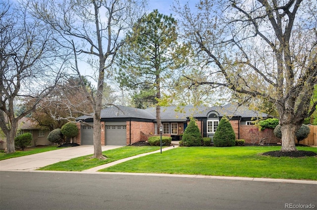 4011 S Ivy Ln, Cherry Hills Village, CO 80111 - view of front of home featuring a garage, driveway, and brick siding