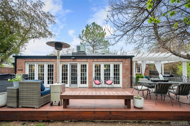 4011 S Ivy Ln, Cherry Hills Village, CO 80111 - back of property with brick siding, outdoor dining space, a pergola, and a wooden deck