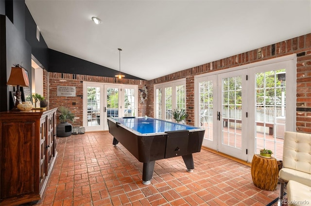 4011 S Ivy Ln, Cherry Hills Village, CO 80111 - recreation room with french doors, brick flooring, plenty of natural light, vaulted ceiling, and brick wall