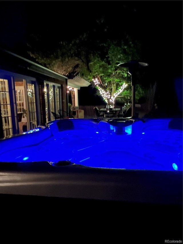 4011 S Ivy Ln, Cherry Hills Village, CO 80111 - pool at twilight with an outdoor hot tub