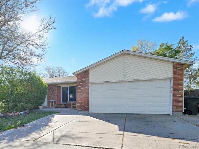ranch-style house with brick siding, driveway, and a garage