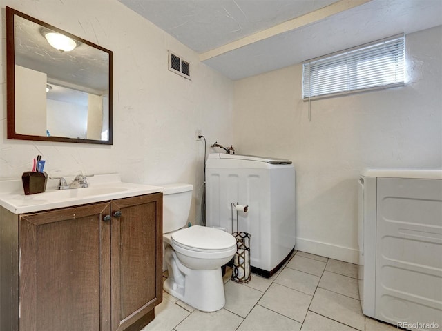 bathroom featuring vanity, tile patterned floors, toilet, and visible vents