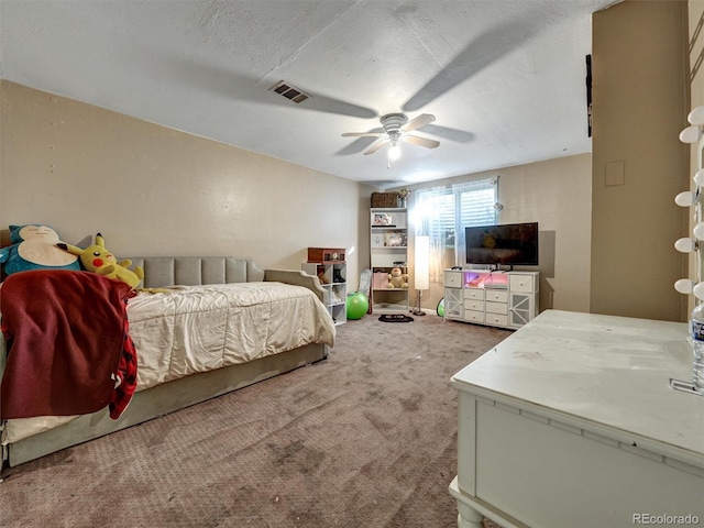 bedroom with a ceiling fan, carpet flooring, and visible vents
