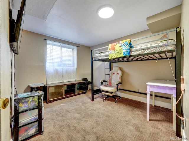carpeted bedroom with baseboards