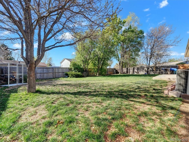 view of yard with a fenced backyard