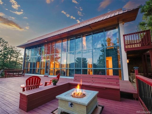 8791 Grizzly Way, Evergreen, CO 80439 - deck at dusk with an outdoor fire pit