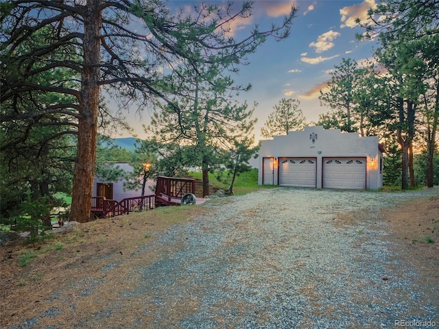 8791 Grizzly Way, Evergreen, CO 80439 - garage featuring driveway
