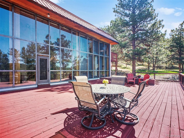 8791 Grizzly Way, Evergreen, CO 80439 - deck featuring a sunroom