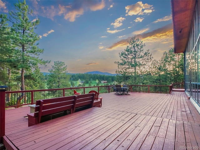 8791 Grizzly Way, Evergreen, CO 80439 - deck at dusk with outdoor dining space