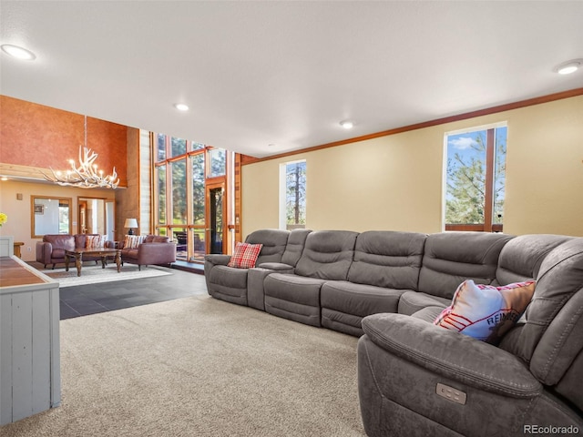 8791 Grizzly Way, Evergreen, CO 80439 - living room featuring a chandelier, recessed lighting, dark colored carpet, and ornamental molding