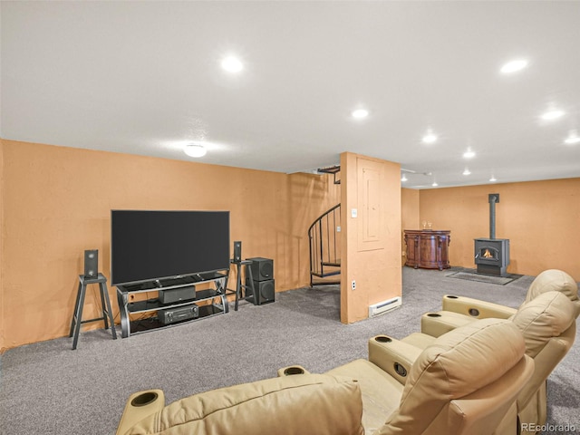 8791 Grizzly Way, Evergreen, CO 80439 - carpeted living area featuring a baseboard heating unit, stairs, a wood stove, and recessed lighting