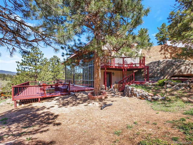 8791 Grizzly Way, Evergreen, CO 80439 - rear view of property with a deck and stairs