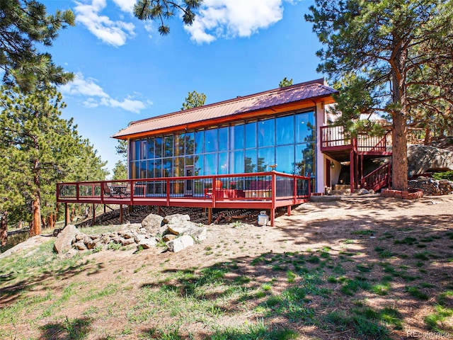 8791 Grizzly Way, Evergreen, CO 80439 - rear view of property featuring a deck and metal roof