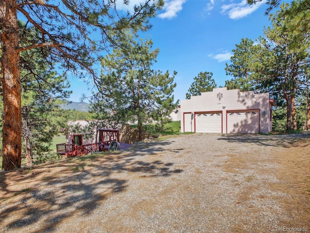 8791 Grizzly Way, Evergreen, CO 80439 - view of yard featuring driveway and an outdoor structure