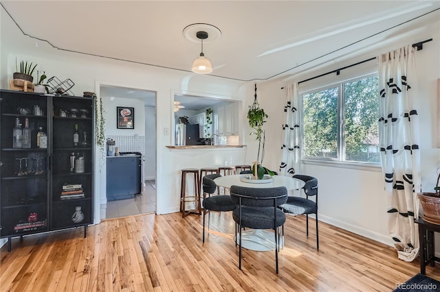 dining area with hardwood / wood-style floors