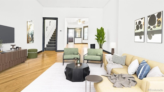 553 N Logan St, Denver, CO 80203 - living room featuring baseboards, stairs, and light wood-style flooring