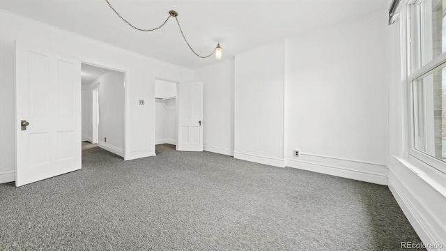 553 N Logan St, Denver, CO 80203 - unfurnished bedroom featuring carpet and baseboards