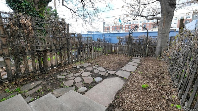 553 N Logan St, Denver, CO 80203 - view of yard featuring a gate and fence