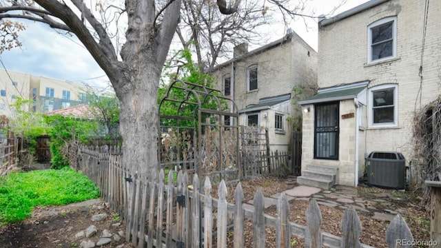 553 N Logan St, Denver, CO 80203 - exterior space featuring central air condition unit, entry steps, and fence private yard