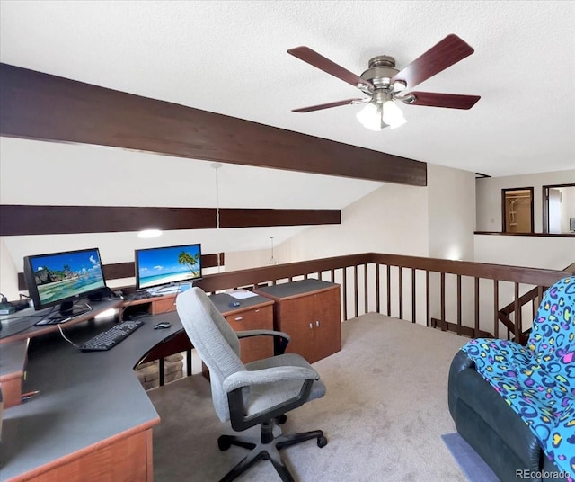home office featuring carpet floors, a ceiling fan, and a textured ceiling