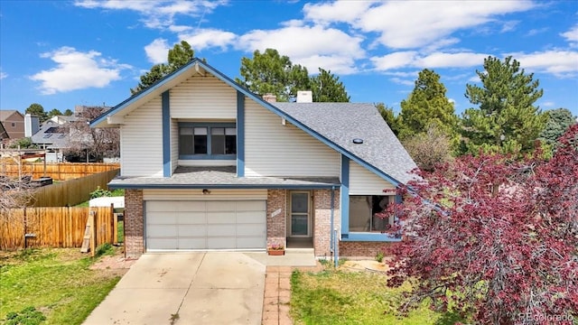 view of front of property with driveway, a garage, brick siding, fence, and a shingled roof