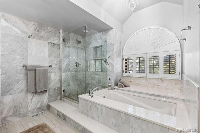 5955 Blue Sage Way, Littleton, CO 80123 - full bathroom featuring a marble finish shower, a garden tub, tile patterned flooring, tile walls, and lofted ceiling
