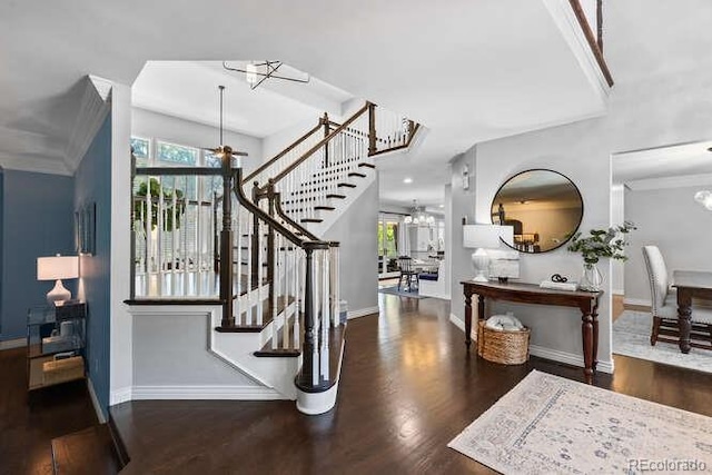 5955 Blue Sage Way, Littleton, CO 80123 - entryway featuring wood finished floors, a chandelier, and stairs