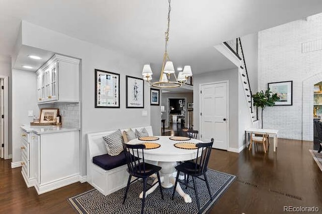 5955 Blue Sage Way, Littleton, CO 80123 - dining space featuring dark wood finished floors and a chandelier