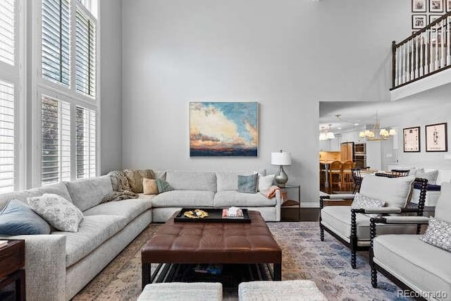 5955 Blue Sage Way, Littleton, CO 80123 - living area with a towering ceiling and wood finished floors