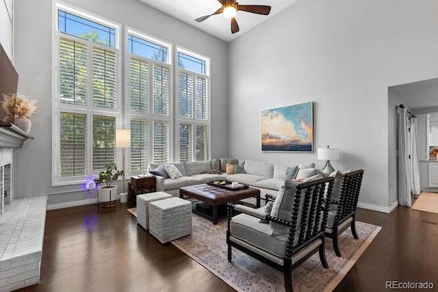 5955 Blue Sage Way, Littleton, CO 80123 - living area featuring high vaulted ceiling, ceiling fan, dark wood-style flooring, and a fireplace