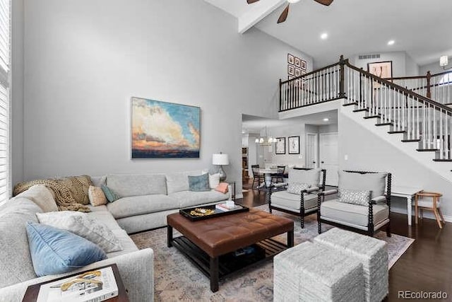 5955 Blue Sage Way, Littleton, CO 80123 - living room featuring ceiling fan, a towering ceiling, wood finished floors, beamed ceiling, and stairway